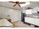 Bedroom with bed, ceiling fans, skylight, and kitchenette at 708 W Pope St, Dunn, NC 28334