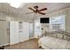 Bedroom with bed, ceiling fan, and plenty of storage at 708 W Pope St, Dunn, NC 28334