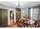 Charming dining room with hardwood floors, traditional furnishings, and ample natural light at 708 W Pope St, Dunn, NC 28334
