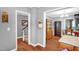 Interior hallway featuring hardwood floors and offering access to various rooms at 708 W Pope St, Dunn, NC 28334