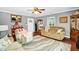 Bright and spacious living room featuring hardwood floors and comfortable furnishings at 708 W Pope St, Dunn, NC 28334