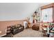 Cozy room with unique decor, including built-in shelving filled with collectibles, and comfortable carpeting at 708 W Pope St, Dunn, NC 28334