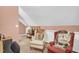 Cozy sitting area featuring 2 antique chairs and vintage television at 708 W Pope St, Dunn, NC 28334