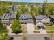 Aerial view of the home in a neighborhood surrounded by lush trees at 725 Ancient Oaks Dr, Holly Springs, NC 27540