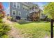 Lovely backyard features a patio and stairs leading to a balcony at 725 Ancient Oaks Dr, Holly Springs, NC 27540