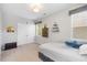 Comfortable bedroom with a bed, storage boxes, and plush carpet at 725 Ancient Oaks Dr, Holly Springs, NC 27540