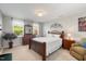 Comfortable bedroom with natural light, neutral color scheme, and a relaxing ambiance at 725 Ancient Oaks Dr, Holly Springs, NC 27540