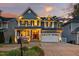 Charming two-story home with a welcoming front porch and well-manicured landscaping at 725 Ancient Oaks Dr, Holly Springs, NC 27540