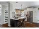 Well-appointed kitchen with stainless steel appliances, granite countertops, and a center island at 725 Ancient Oaks Dr, Holly Springs, NC 27540