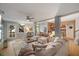 Bright and airy living room with plush seating, ceiling fan, and plenty of natural light at 725 Ancient Oaks Dr, Holly Springs, NC 27540