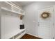 Functional mudroom with storage cubbies, a bench, and coat hooks, keeping the entrance tidy at 725 Ancient Oaks Dr, Holly Springs, NC 27540