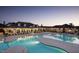 Large community pool with plenty of lounge chairs and covered seating areas at 725 Ancient Oaks Dr, Holly Springs, NC 27540