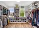 Well-organized walk-in closet with custom shelving, hanging rods, and plenty of storage space at 725 Ancient Oaks Dr, Holly Springs, NC 27540