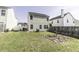 Backyard with a well-maintained lawn and a view of the house's rear exterior at 7528 Argent Valley Dr, Raleigh, NC 27616