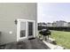 Inviting backyard featuring a patio with a grill and lawn at 7528 Argent Valley Dr, Raleigh, NC 27616