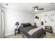Cozy bedroom with neutral walls, ceiling fan, and ensuite door at 7528 Argent Valley Dr, Raleigh, NC 27616