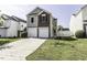 Charming two-story home featuring a well-manicured lawn and a two-car garage at 7528 Argent Valley Dr, Raleigh, NC 27616