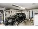 Spacious garage featuring a black SUV and an automatic door opener at 7528 Argent Valley Dr, Raleigh, NC 27616