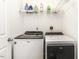 Practical laundry area featuring modern washer and dryer appliances at 7528 Argent Valley Dr, Raleigh, NC 27616