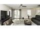 Bright living room with door to outdoor space and comfortable furnishings at 7528 Argent Valley Dr, Raleigh, NC 27616