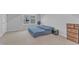 Empty bedroom with carpet, natural light, a window, and a wooden dresser at 8601 Red Canyon Way, Raleigh, NC 27616