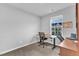 Minimalist bedroom featuring a desk, chair, and natural light from the windows at 8601 Red Canyon Way, Raleigh, NC 27616
