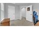 Bedroom featuring a closet, open door to another room, and neutral carpet at 8601 Red Canyon Way, Raleigh, NC 27616