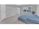 Bedroom with carpet, natural light from two windows, and a view to the outdoors at 8601 Red Canyon Way, Raleigh, NC 27616