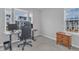 Bright bedroom featuring a desk, computer, and natural light from the windows at 8601 Red Canyon Way, Raleigh, NC 27616