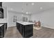 Well-designed kitchen with a large island, modern fixtures, and an adjacent dining area at 8601 Red Canyon Way, Raleigh, NC 27616