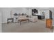 Spacious living room with plush carpeting, contemporary decor, and ample natural light at 8601 Red Canyon Way, Raleigh, NC 27616