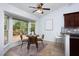 Cozy breakfast nook with bay window, modern light fixture, and seating for four near the kitchen at 901 Clifford Dr, Durham, NC 27704