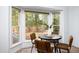 Cozy breakfast nook with seating for four featuring an abundance of natural light and outdoor views at 901 Clifford Dr, Durham, NC 27704