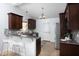 Open concept kitchen featuring granite countertops, stainless steel appliances, and stylish backsplash at 901 Clifford Dr, Durham, NC 27704