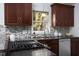 Close up of kitchen granite countertops and modern appliances under updated cabinetry at 901 Clifford Dr, Durham, NC 27704