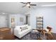 Inviting living area with a large white sofa, modern decor, and natural light at 901 Clifford Dr, Durham, NC 27704