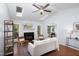 Bright living room with skylights, fireplace, and open floor plan to the dining room at 901 Clifford Dr, Durham, NC 27704