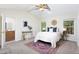 Bright main bedroom featuring a ceiling fan, vaulted ceiling, and ensuite bathroom at 901 Clifford Dr, Durham, NC 27704
