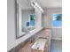 Bathroom featuring double sinks, granite counters, new fixtures, and modern lighting at 901 Forge Rd, Durham, NC 27713