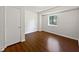 Inviting bedroom featuring hardwood flooring, a large closet, and natural light at 901 Forge Rd, Durham, NC 27713