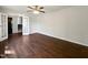 Inviting living room with hardwood floors, ceiling fan, and staircase access at 901 Forge Rd, Durham, NC 27713