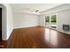 Bright living room boasts hardwood flooring and french doors leading to the backyard at 901 Forge Rd, Durham, NC 27713