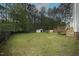 Spacious backyard with a deck and partial fence at 910 Cedar Creek Dr, Wendell, NC 27591