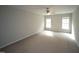 Spacious bedroom featuring two windows and a ceiling fan at 910 Cedar Creek Dr, Wendell, NC 27591