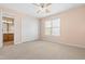 Bedroom featuring neutral walls, carpeted floors, a ceiling fan, closet, and window at 1012 Trail Stream Way, Knightdale, NC 27545