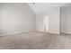 Bright bedroom with high ceiling, neutral walls, carpet, with view to ensuite bathroom at 1012 Trail Stream Way, Knightdale, NC 27545