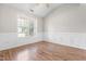 Bright bedroom with hardwood floors, crown molding, and a large window at 1012 Trail Stream Way, Knightdale, NC 27545