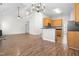 Bright open floor plan featuring hardwood floors, access to kitchen, and natural light at 1012 Trail Stream Way, Knightdale, NC 27545