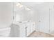 Bathroom with double sinks, a large mirror, and ample cabinet space at 104 Rosebud Ln, Durham, NC 27704