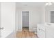 Bathroom with a white vanity and an adjacent door leading to a walk-in closet at 104 Rosebud Ln, Durham, NC 27704